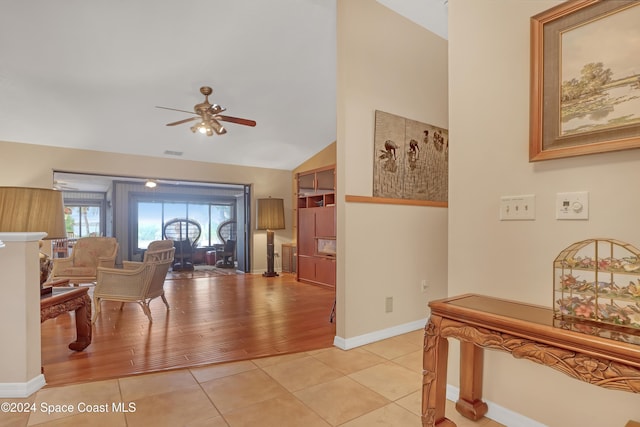 interior space with light hardwood / wood-style floors and lofted ceiling