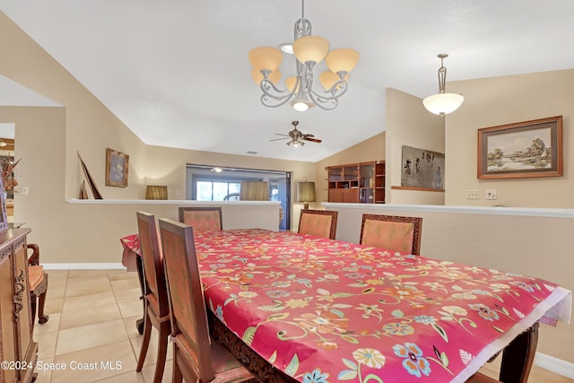 tiled dining area with ceiling fan with notable chandelier and lofted ceiling