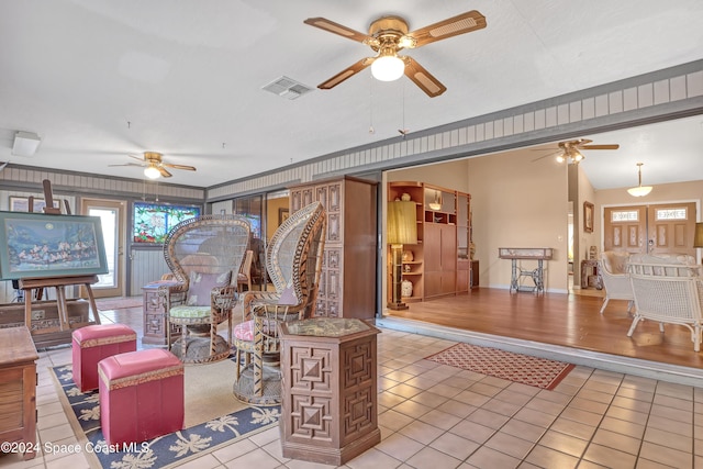 living room with light tile patterned floors and vaulted ceiling