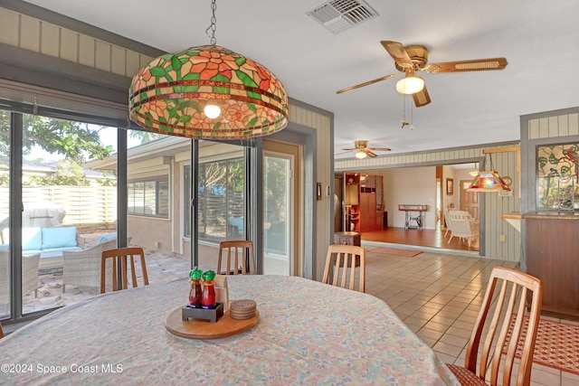 dining space with ceiling fan, plenty of natural light, and light tile patterned flooring