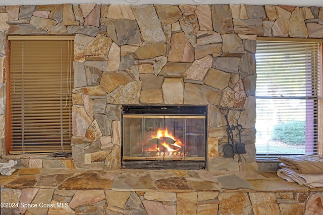 room details featuring a stone fireplace