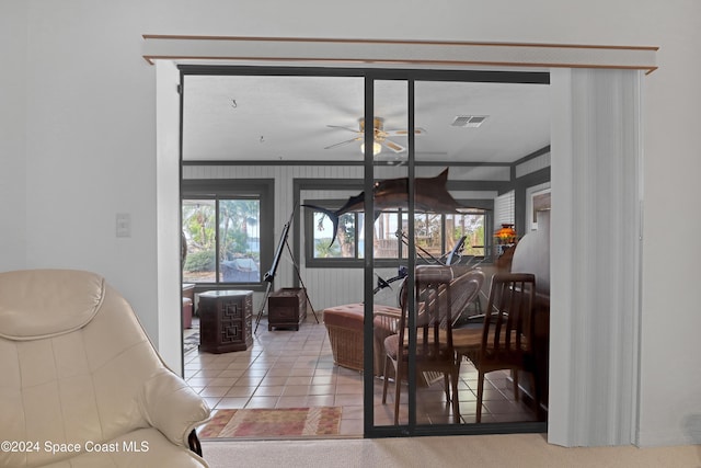 dining area featuring tile patterned floors and ceiling fan