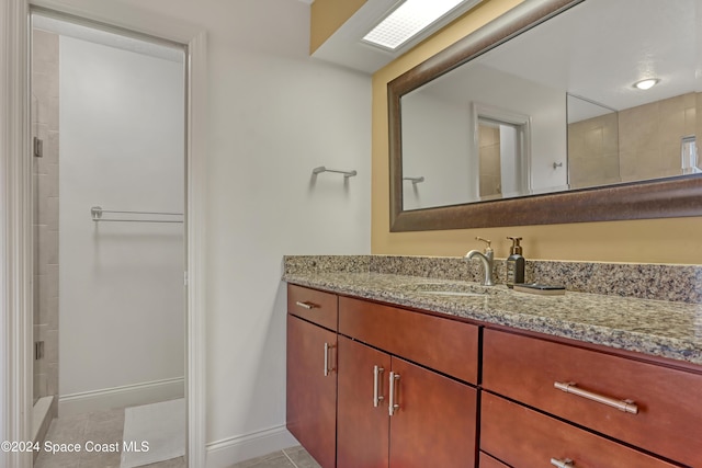 bathroom with tile patterned flooring and vanity