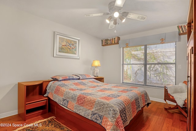 bedroom featuring ceiling fan and hardwood / wood-style flooring