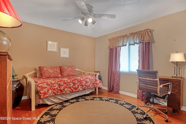 bedroom featuring ceiling fan and light hardwood / wood-style floors