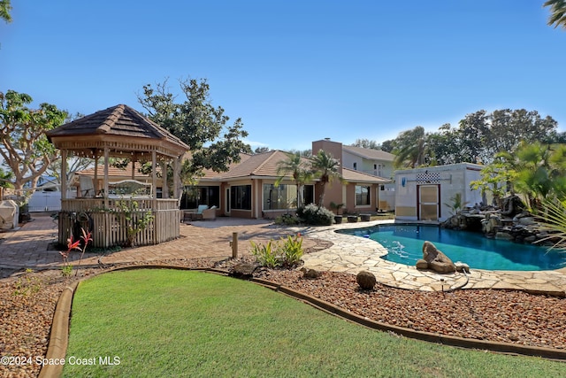 view of swimming pool with a gazebo and a patio