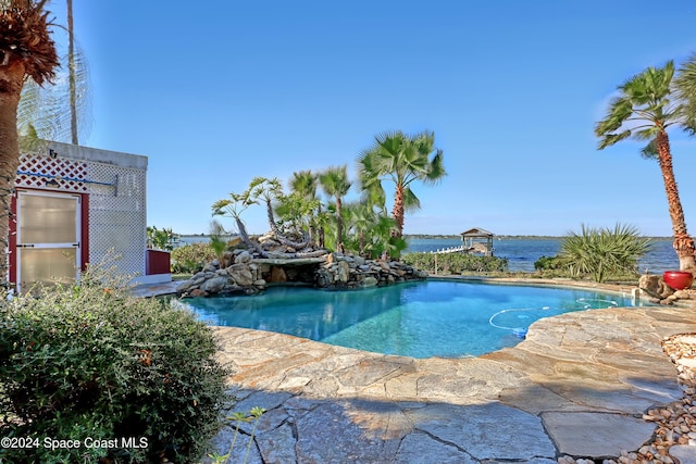 view of pool with a water view