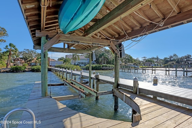 view of dock with a water view