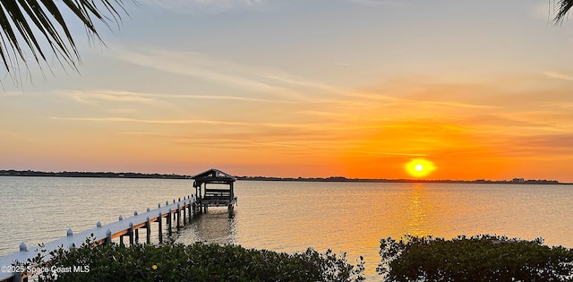 1940 Gates Rd, Merritt Island, FL 32952 - dock featuring a water view and boat lift