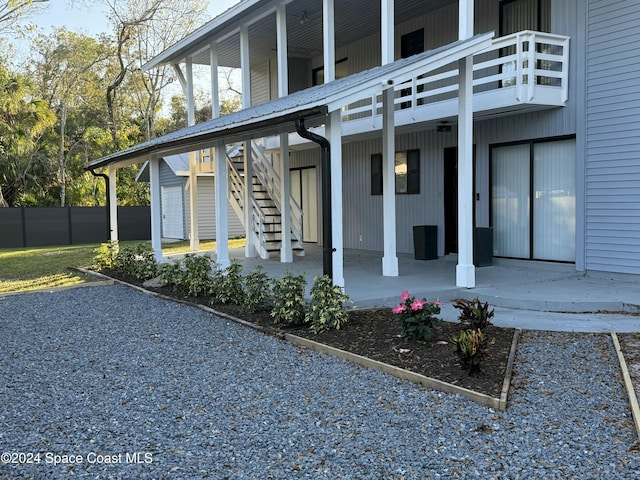 135 Belmont Ave, Cocoa, FL 32927 - back of house featuring stairs and a balcony