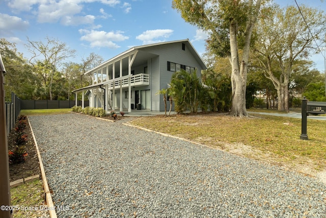 view of side of property with a balcony