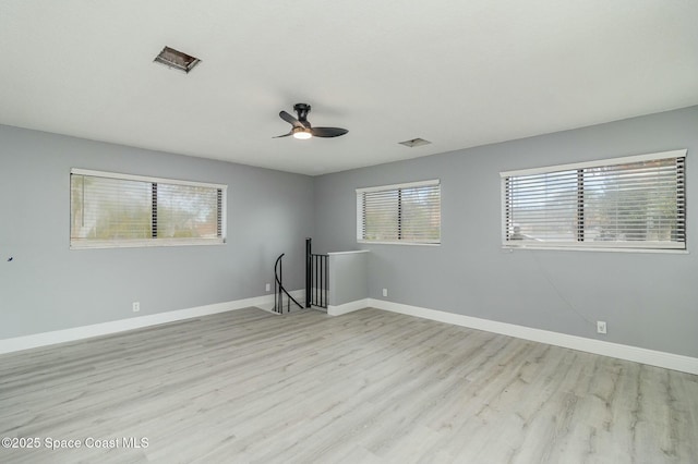 empty room featuring light hardwood / wood-style floors and ceiling fan