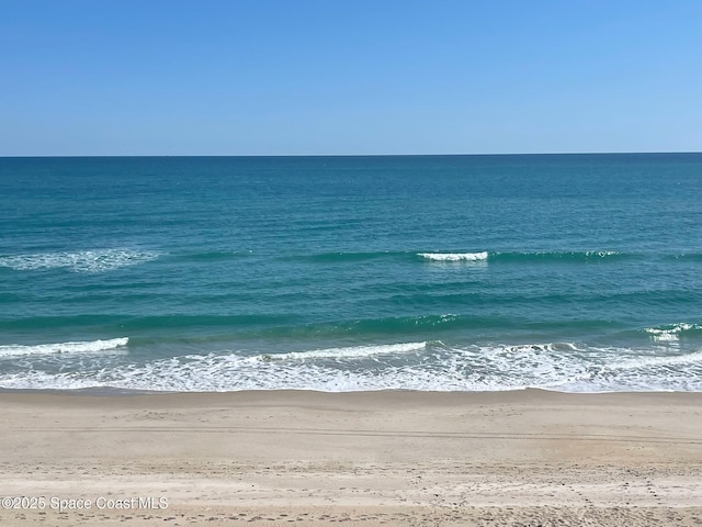 view of water feature with a beach view