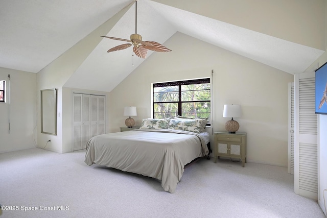 bedroom featuring ceiling fan, light colored carpet, and vaulted ceiling