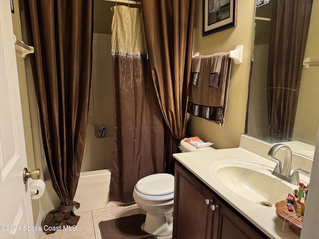 bathroom featuring tile patterned floors, a shower with curtain, vanity, and toilet