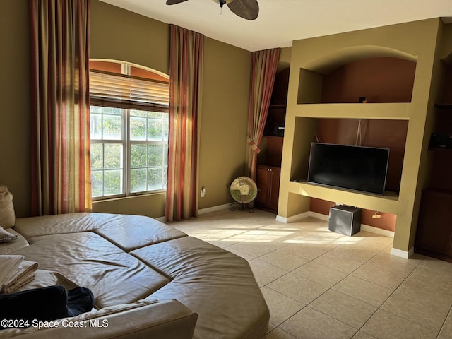 bedroom featuring light tile patterned floors and ceiling fan