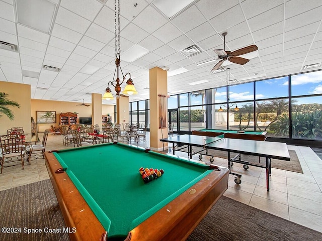 rec room with tile patterned flooring, ceiling fan, floor to ceiling windows, and billiards