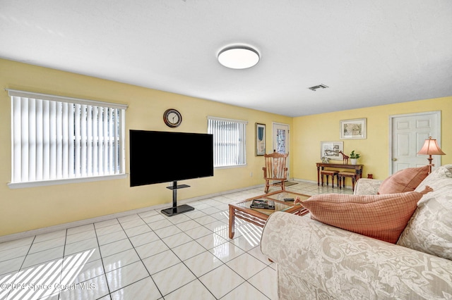 living room with light tile patterned flooring