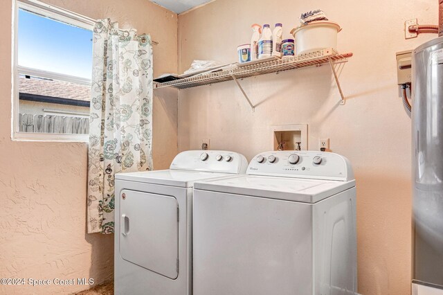 laundry room featuring separate washer and dryer