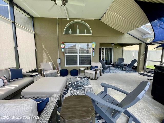 view of patio with an outdoor living space and ceiling fan