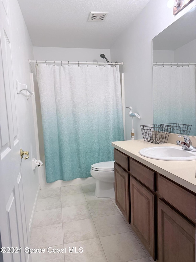 full bath featuring tile patterned flooring, visible vents, vanity, and toilet