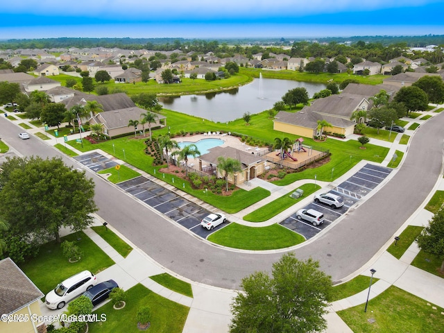 aerial view featuring a water view and a residential view