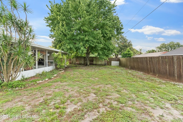 view of yard with a sunroom