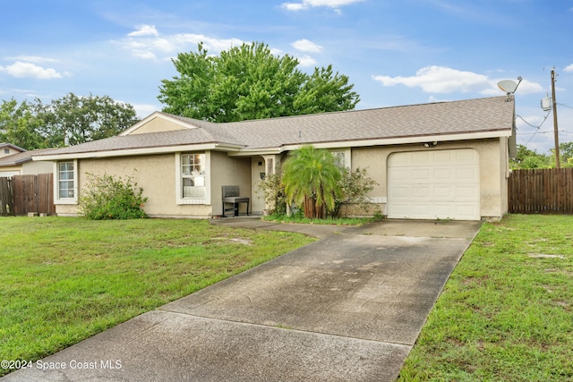 ranch-style house featuring a garage and a front yard