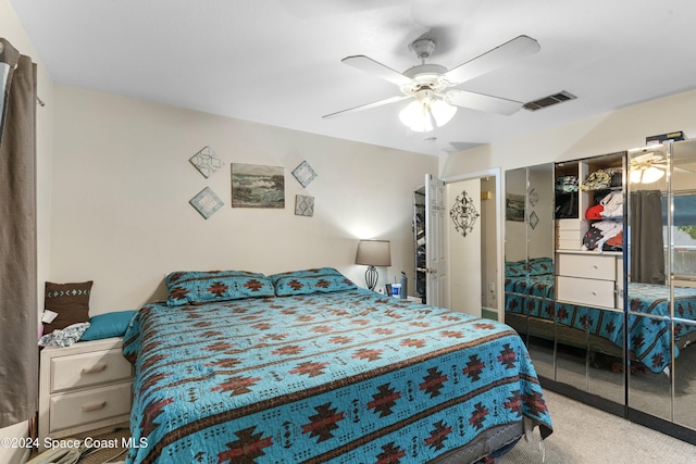 bedroom with ceiling fan and carpet