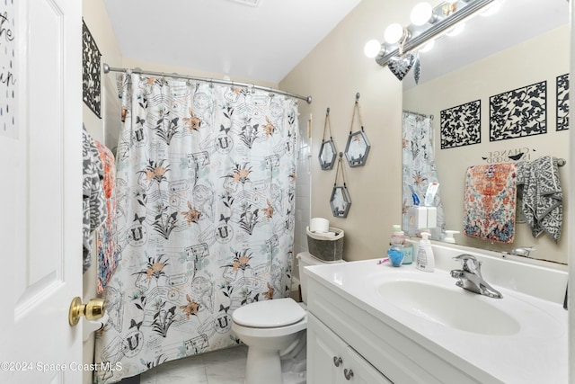 bathroom featuring vanity, a shower with shower curtain, and toilet