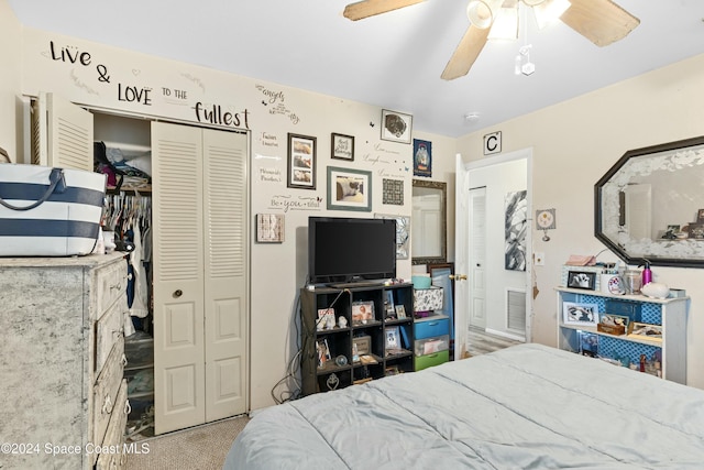 carpeted bedroom with ceiling fan