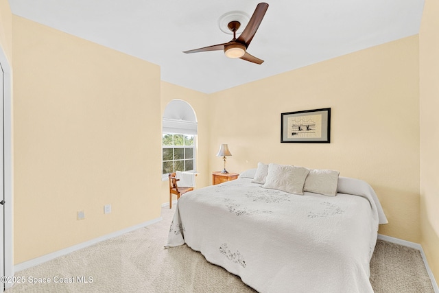 bedroom with ceiling fan and carpet floors