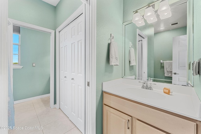 bathroom featuring tile patterned floors and vanity