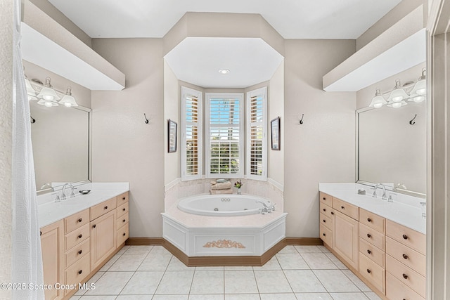 bathroom featuring a bathtub, tile patterned floors, and vanity