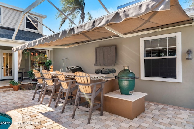 view of patio / terrace with a lanai