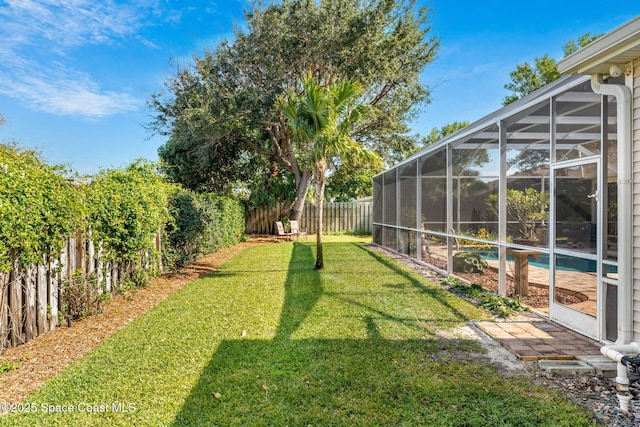 view of yard featuring a lanai and a fenced in pool