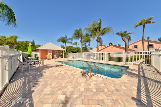 view of swimming pool featuring a patio