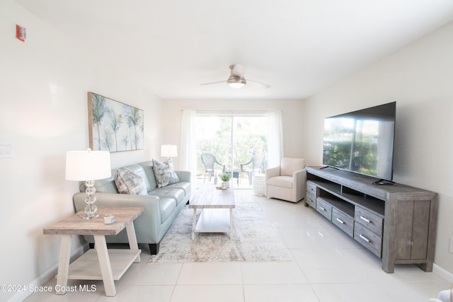 living room featuring light tile patterned floors and ceiling fan