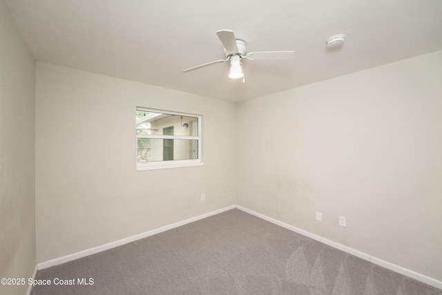 unfurnished room featuring ceiling fan and carpet flooring