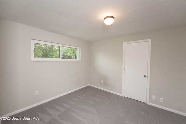 empty room with carpet flooring