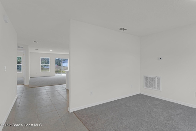 empty room with light tile patterned floors