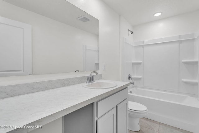 full bathroom featuring tile patterned flooring, vanity, toilet, and shower / washtub combination