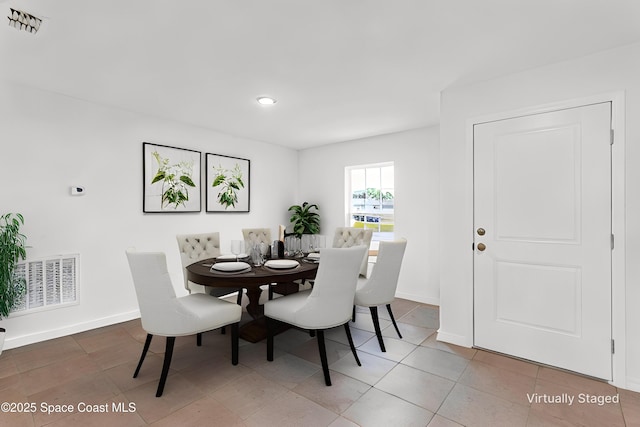 view of tiled dining space