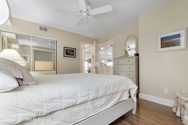 bedroom with ceiling fan, dark hardwood / wood-style floors, and a closet