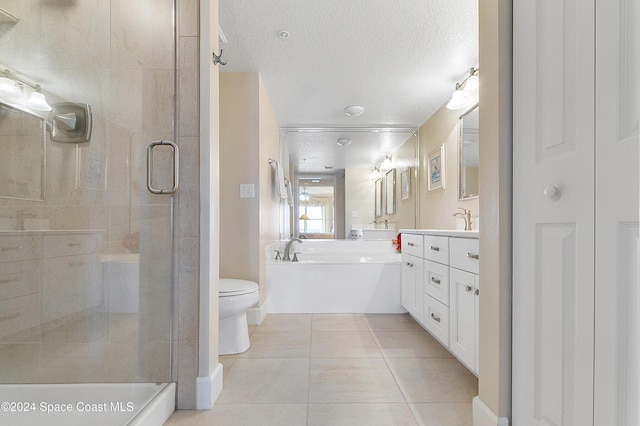 full bathroom featuring tile patterned floors, vanity, a textured ceiling, plus walk in shower, and toilet