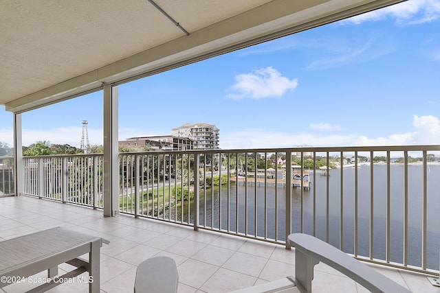 balcony featuring a water view