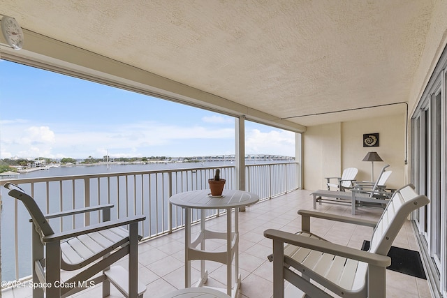 balcony featuring a water view