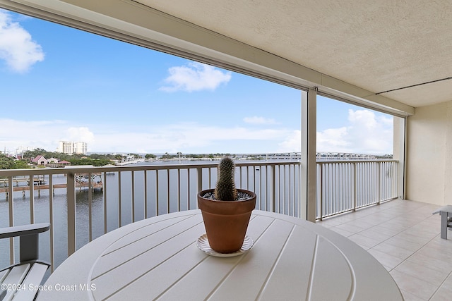 balcony featuring a water view