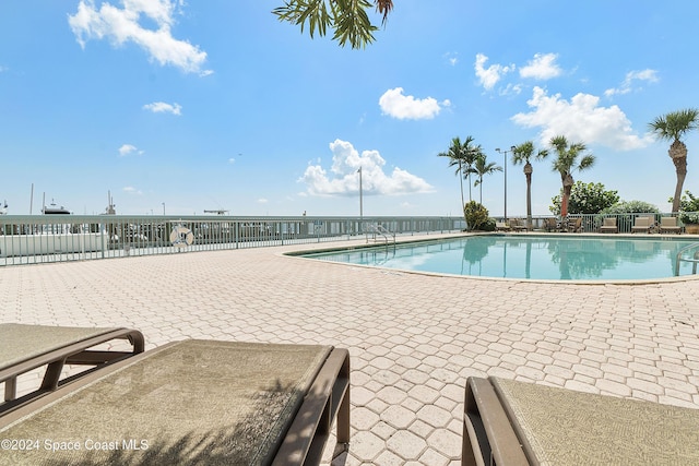 view of pool featuring a patio