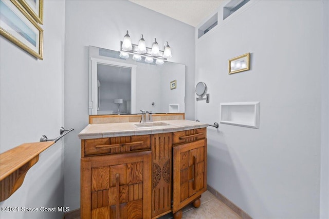 bathroom with tile patterned flooring and vanity